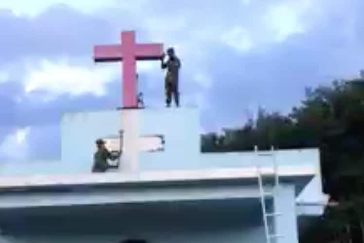 rebel soldiers remove cross from church as persecution in myanmar intensifies