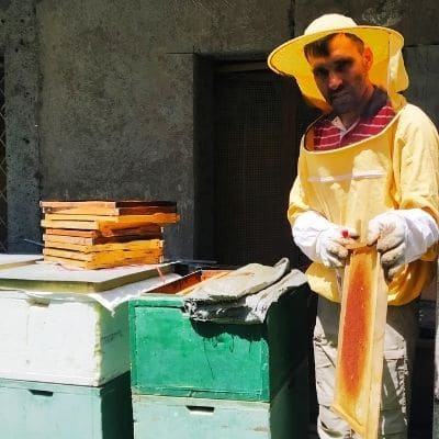 Yusuf with the Beehives - Advancing Native Missions Blog Image