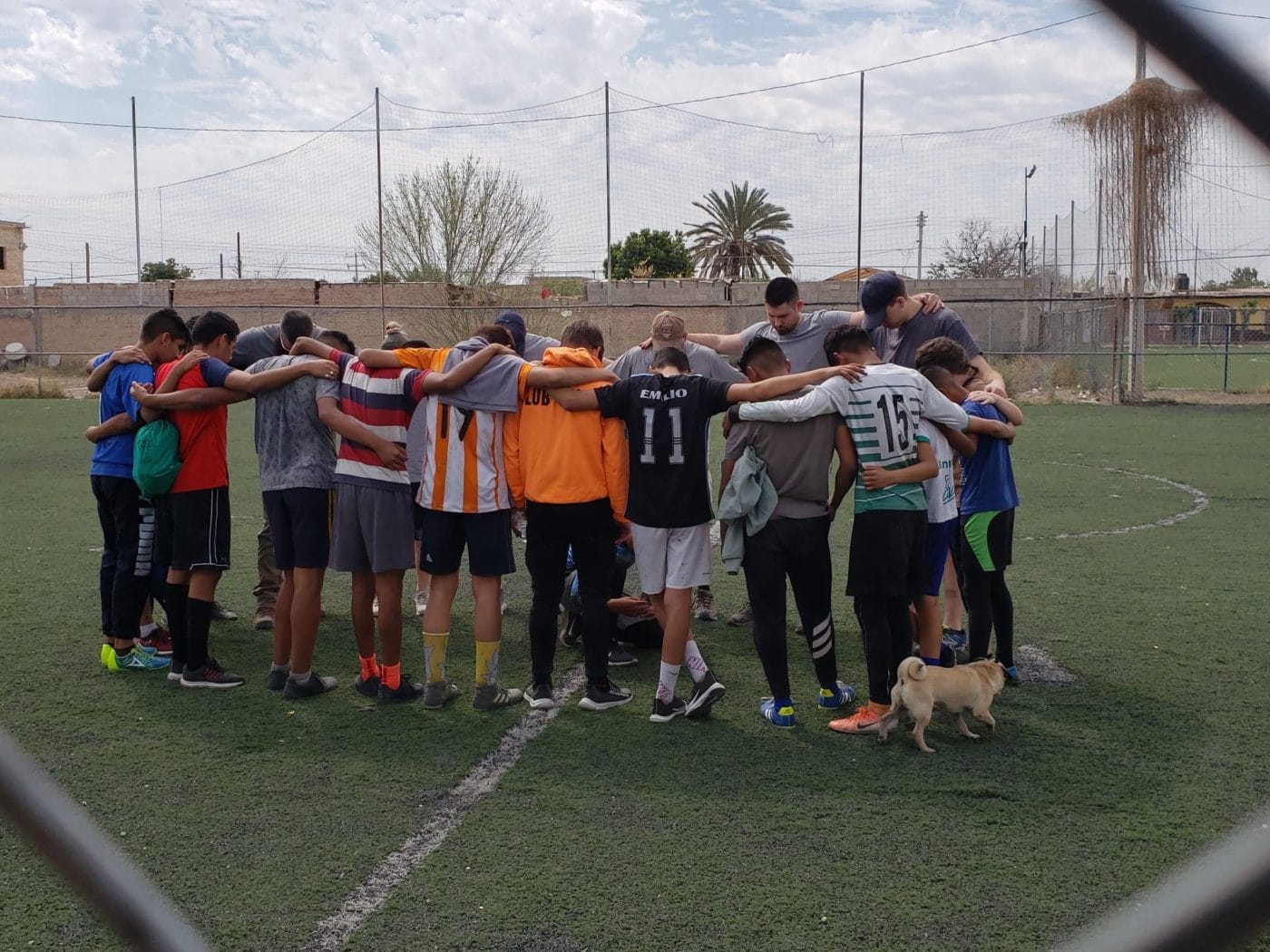 A group of young men from San Pedro standing together after a soccer game
