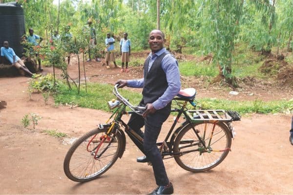 a pastor on a bike